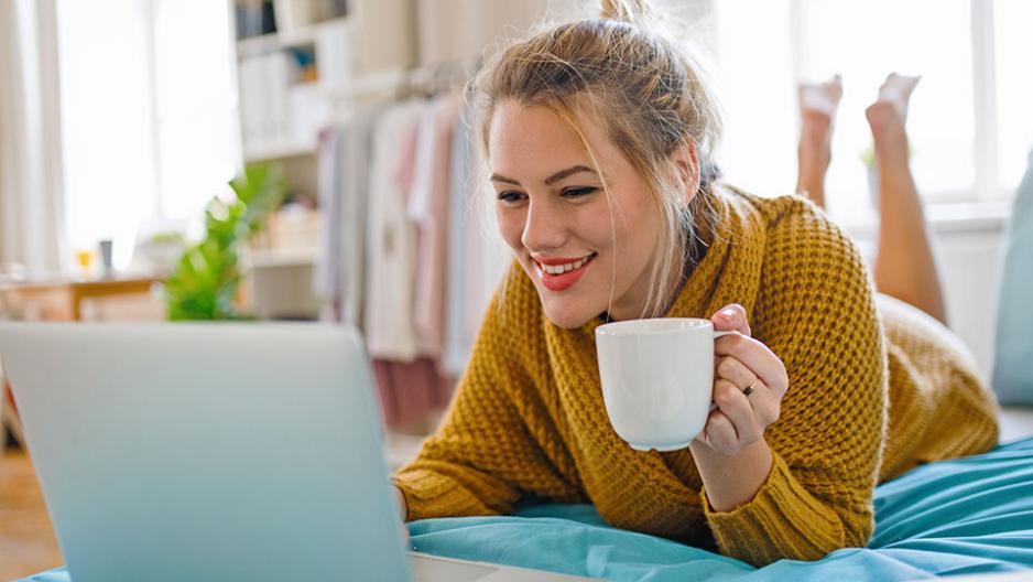 Student with coffee at home starting their studies for an online course.